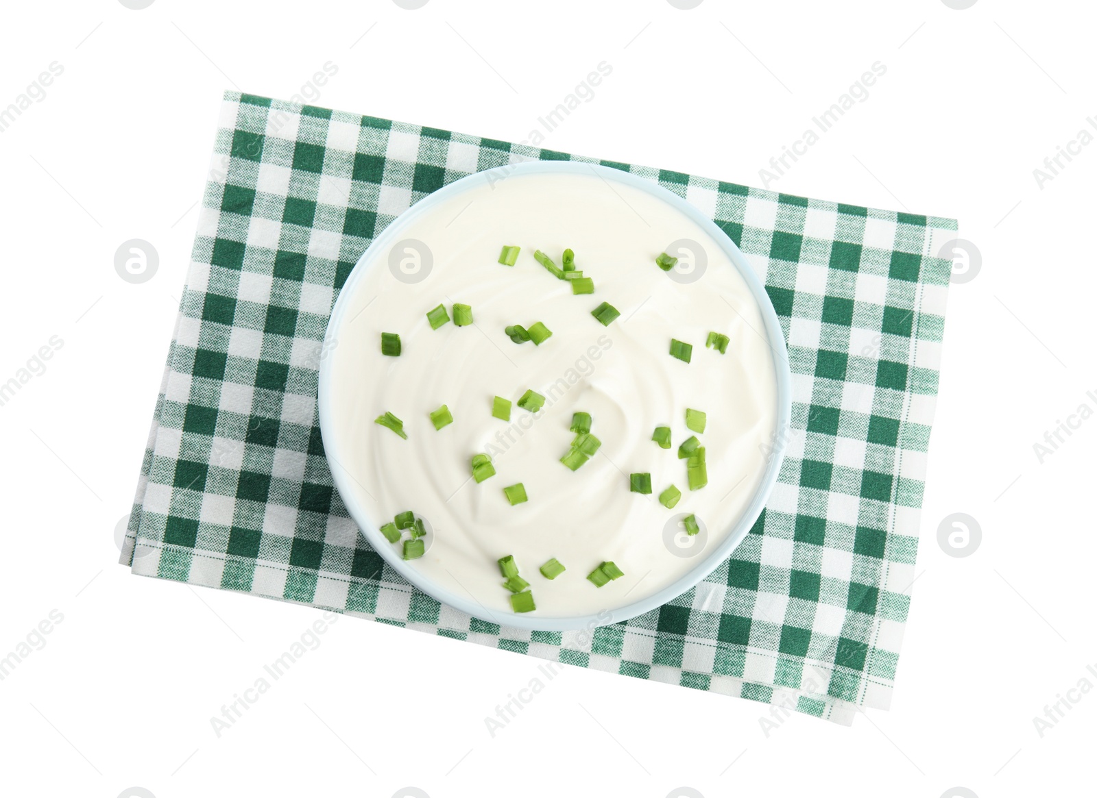 Photo of Fresh sour cream with onion and fabric on white background, top view