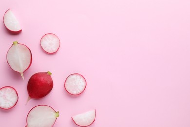 Photo of Fresh ripe radish on pink background, flat lay. Space for text