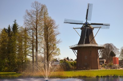 Park with fountain and windmill on sunny day