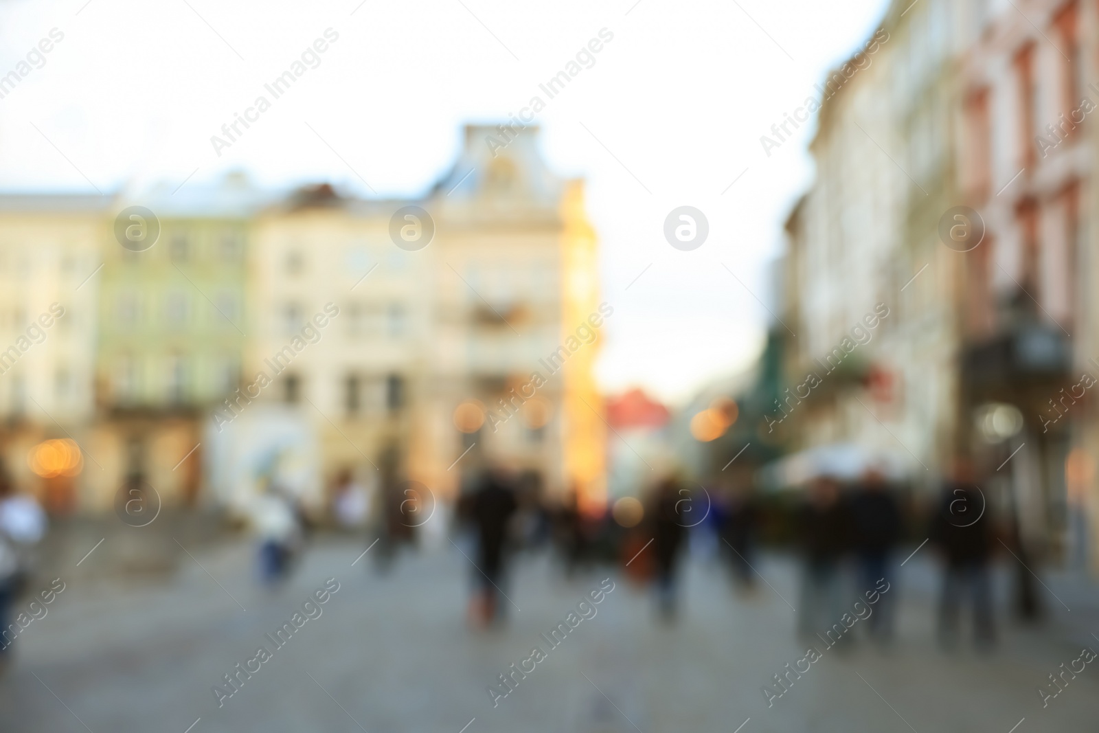 Photo of Blurred view of people walking on city street