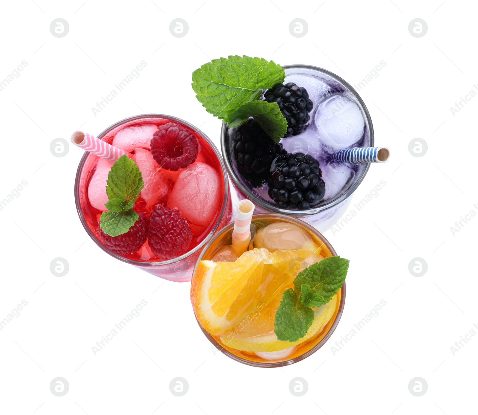 Photo of Different delicious lemonades made with soda water on white background, top view