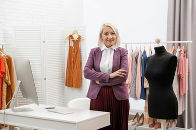 Photo of Confident female business owner in her boutique