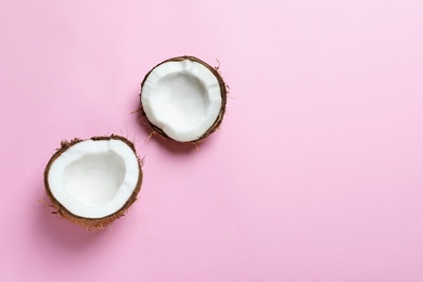 Photo of Coconut halves on color background