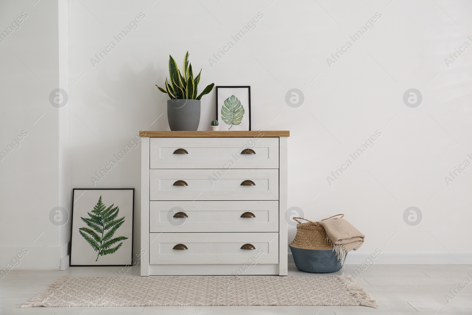 Photo of Stylish chest of drawers in living room interior