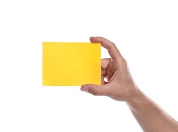 Football referee holding yellow card on white background, closeup