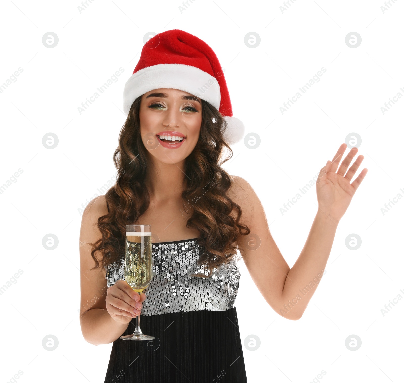 Photo of Beautiful woman in Santa hat holding glass of champagne on white background. Christmas party