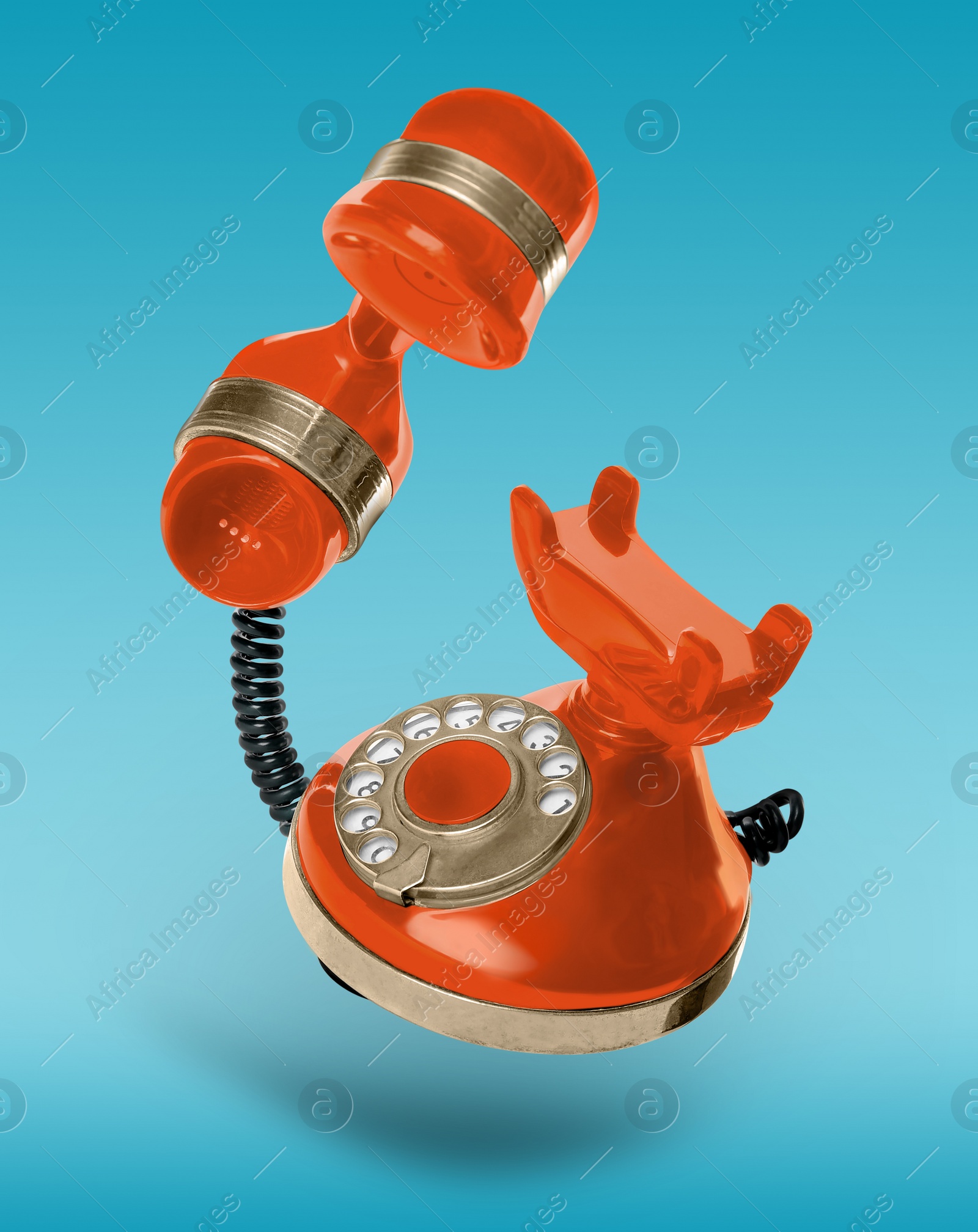 Vintage orange corded telephone flying in air on light blue background Image of Vintage orange corded telephone flying in air on light blue background