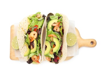 Photo of Delicious tacos with shrimps, avocado and lime on white background, top view