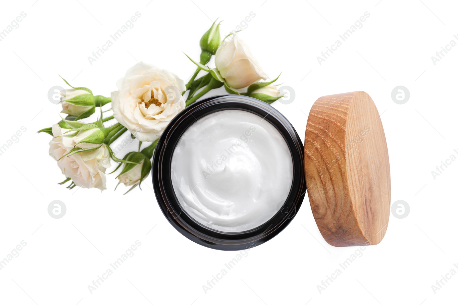 Photo of Jar of hand cream and roses on white background, top view