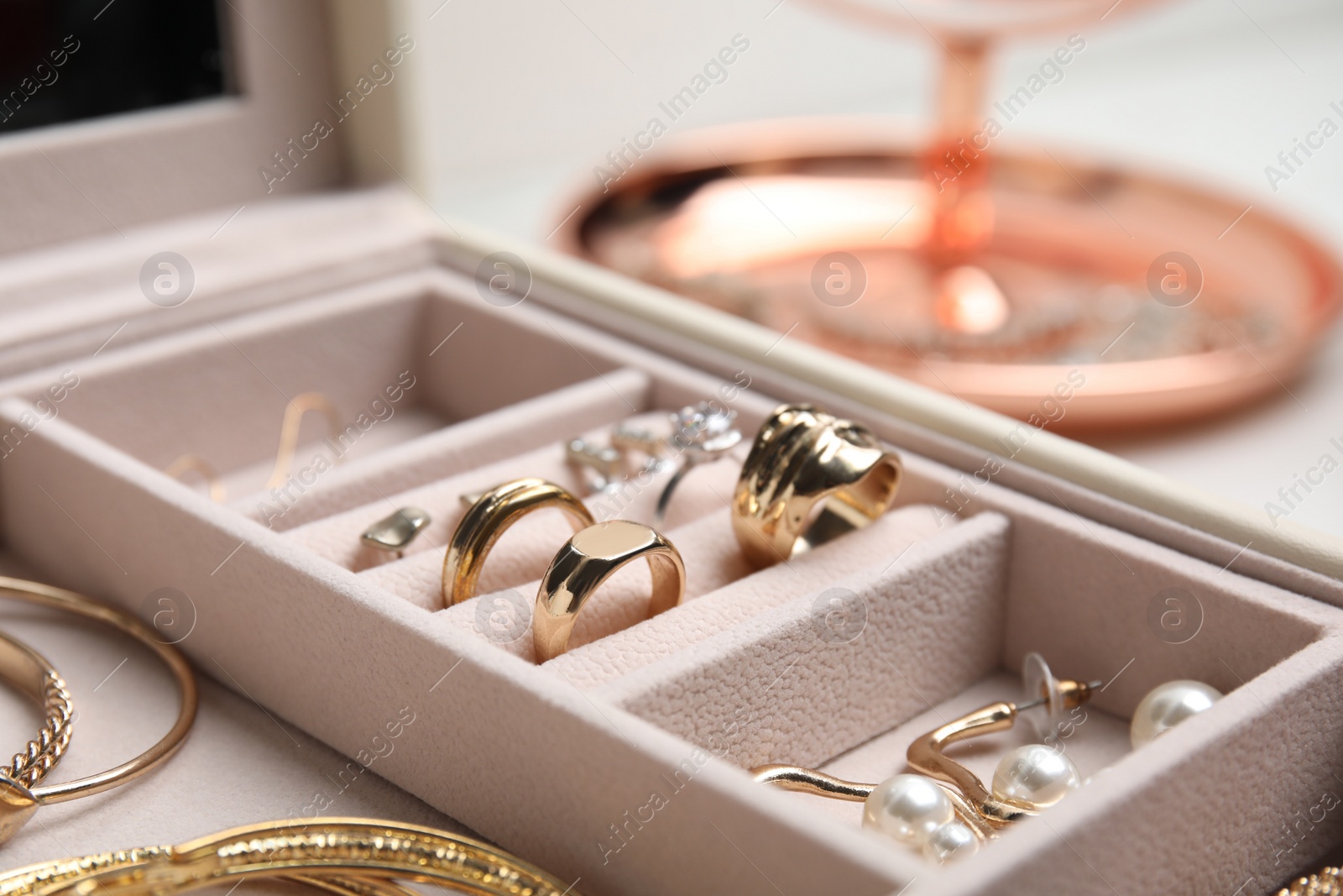 Photo of Jewelry box with stylish golden bijouterie, closeup view