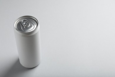 Can of energy drink on white background. Space for text