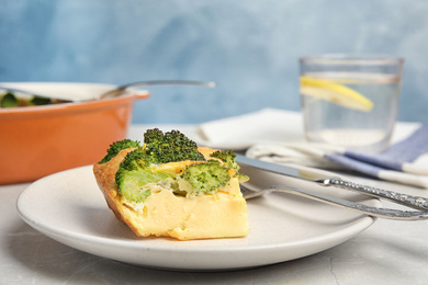 Tasty broccoli casserole served on grey marble table