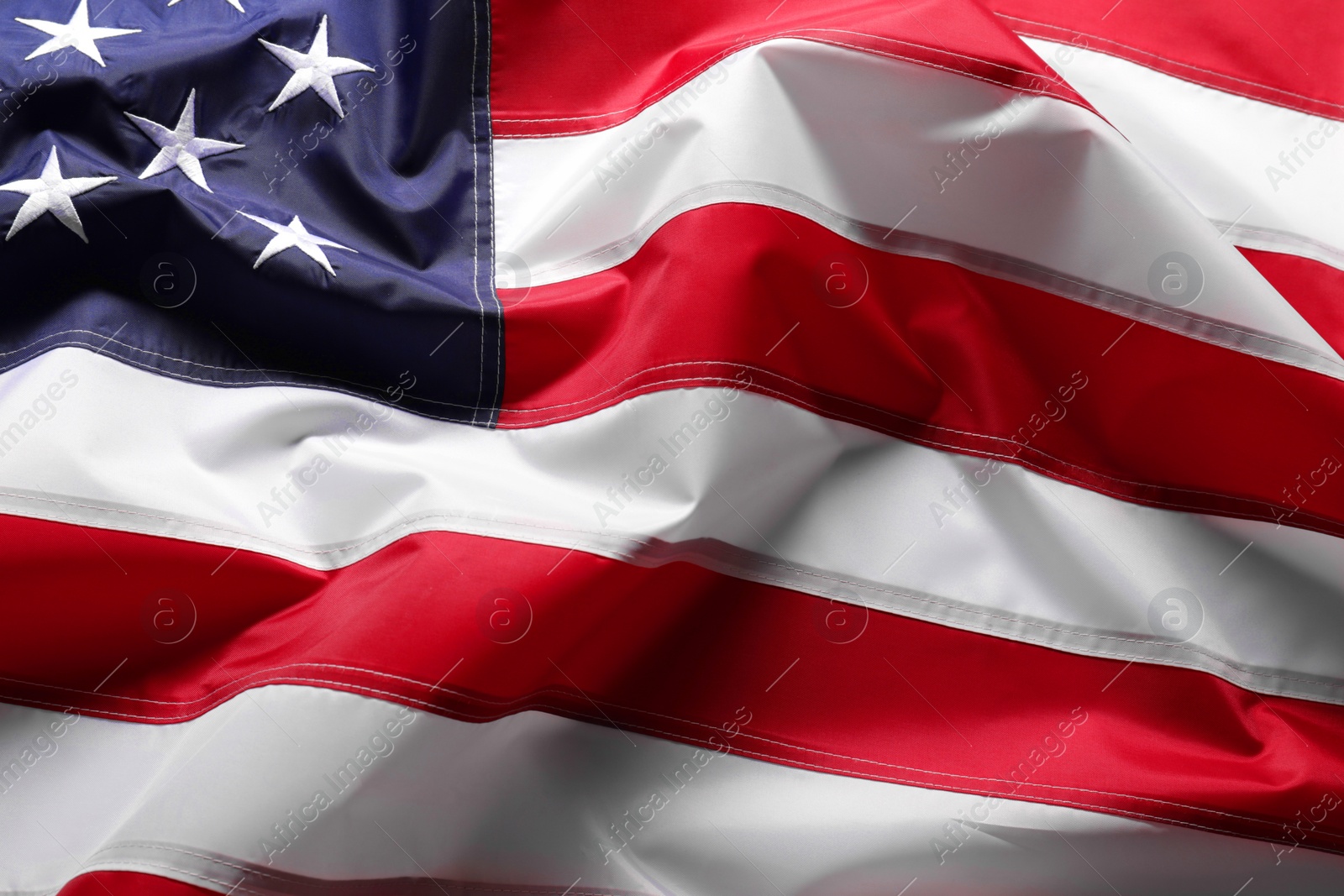 Photo of Beautiful national flag of USA as background, closeup