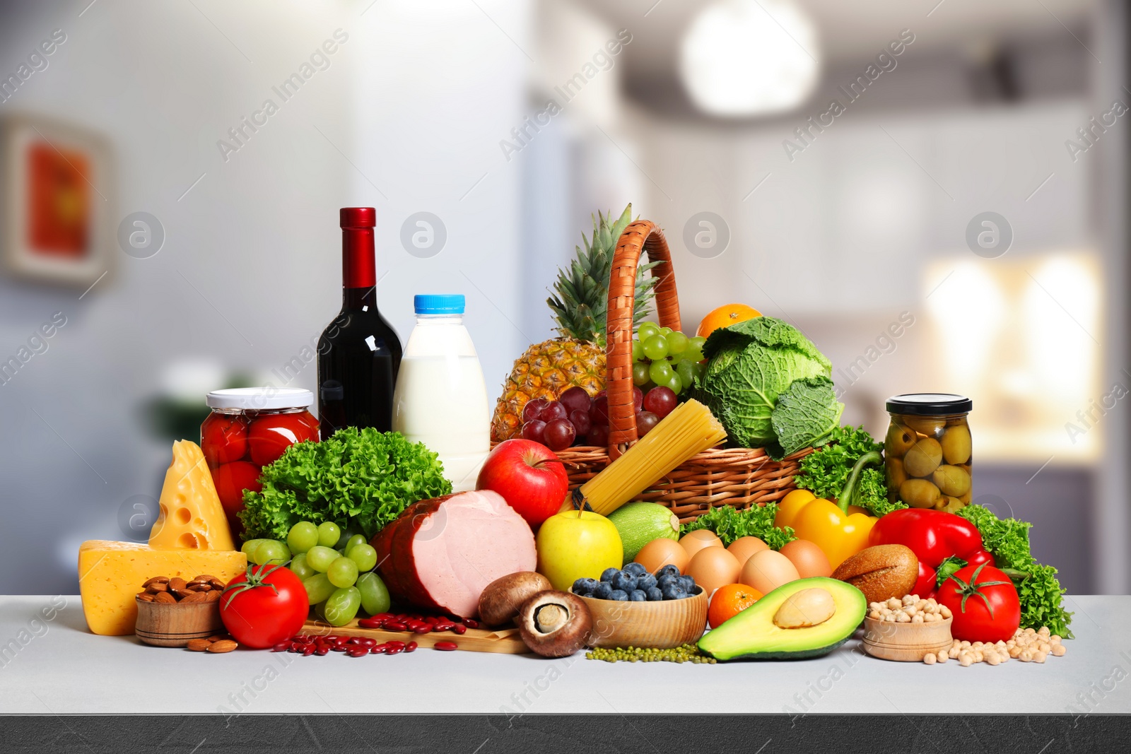 Image of Different products on wooden table in kitchen. Balanced food