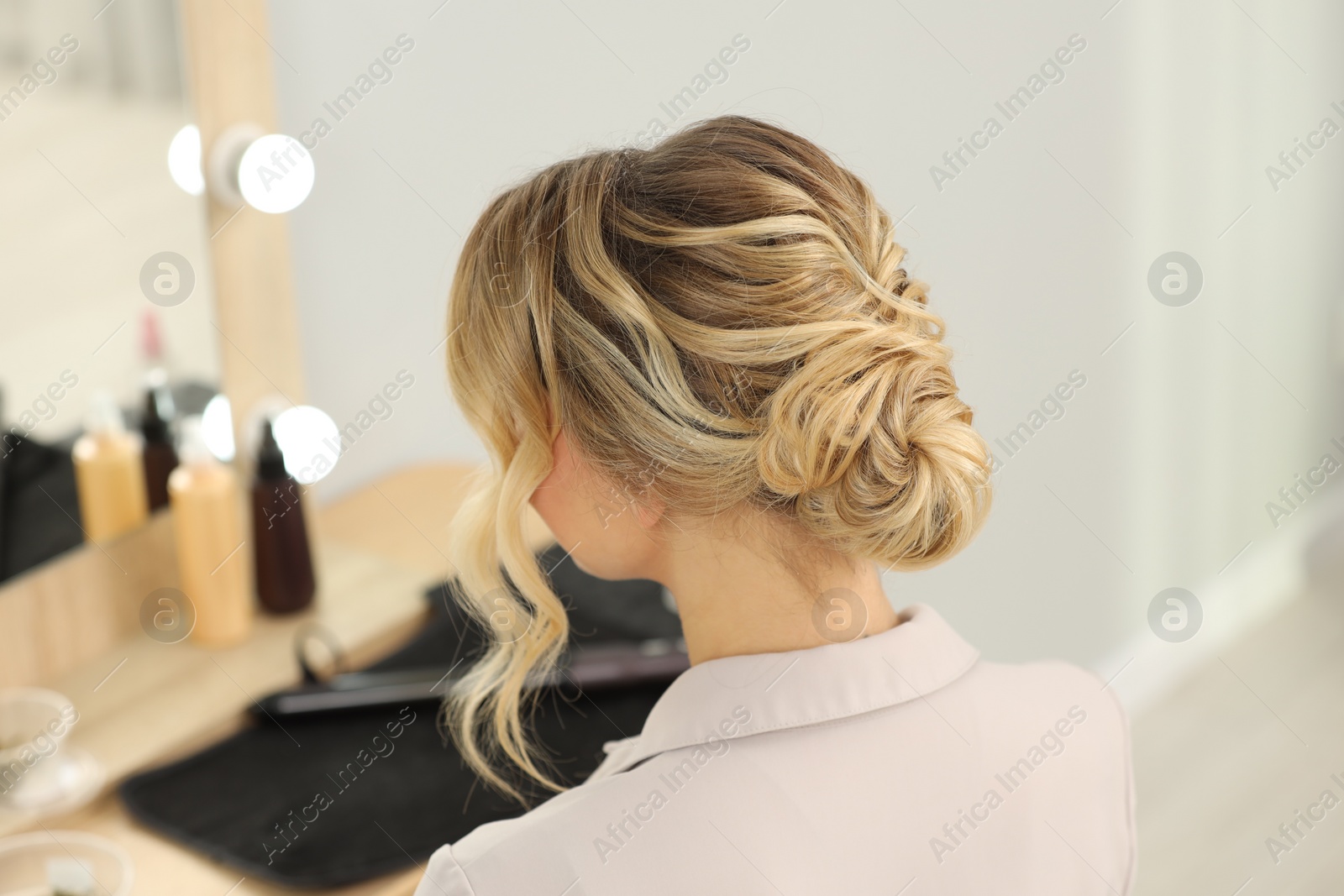 Photo of Woman with beautiful hair style in salon