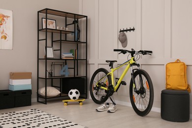 Sports equipment in stylish teenager's room interior