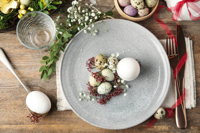 Photo of Festive Easter table setting with beautiful floral decor, flat lay