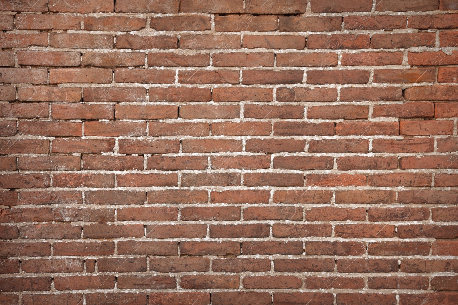 Photo of Texture of old red brick wall as background