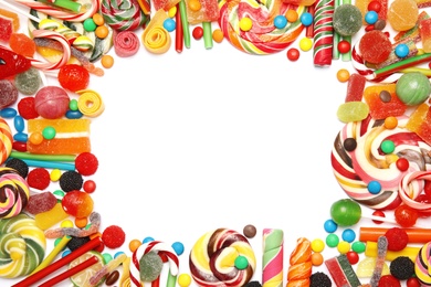 Photo of Many different yummy candies on white background, top view. Space for text