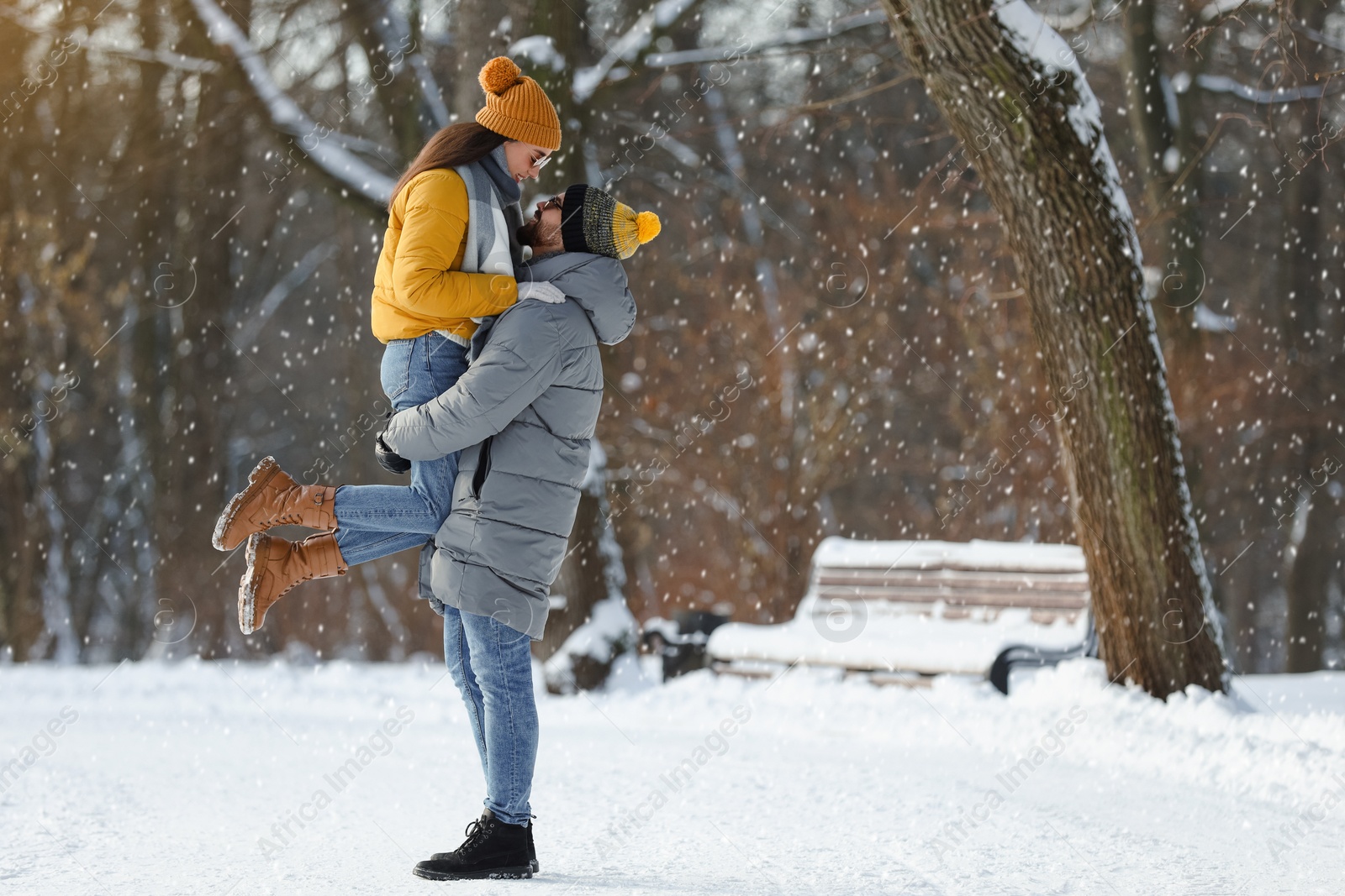 Photo of Beautiful happy couple outdoors on winter day. Space for text