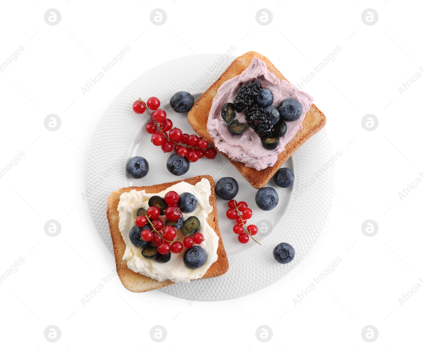 Photo of Tasty sandwiches with cream cheese, blueberries, red currants and blackberries on white background, top view