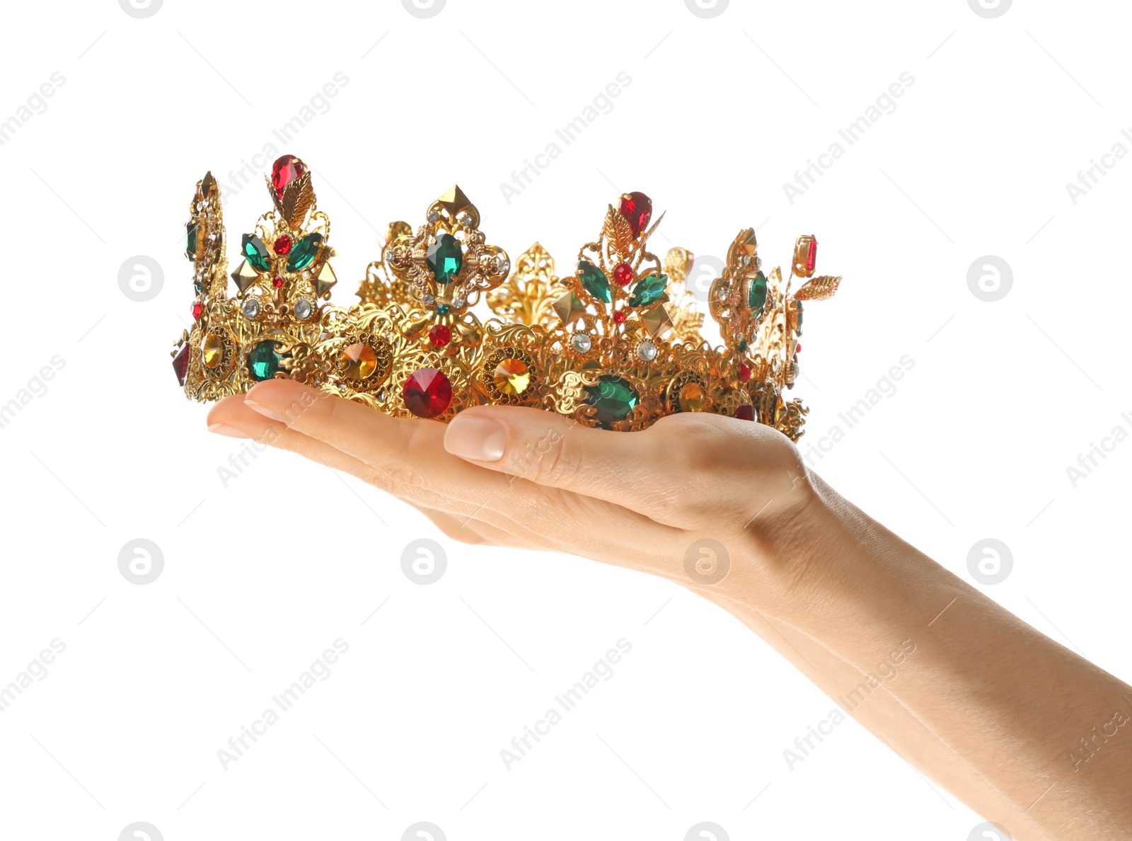 Photo of Woman holding beautiful golden crown on white background, closeup. Fantasy item