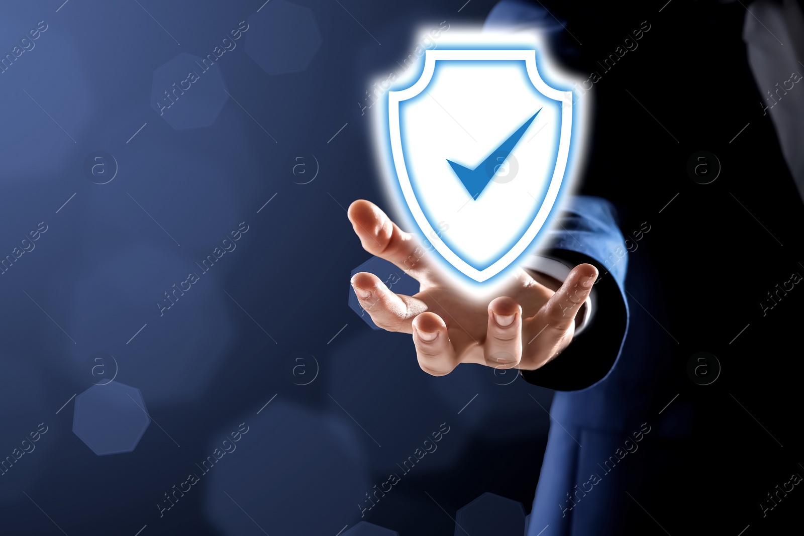 Image of Anti-fraud security system. Man with illustration of checkmark in shield on dark background, closeup. Space for text