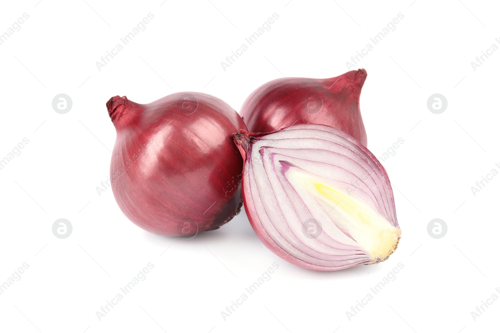 Photo of Fresh whole and cut red onions on white background