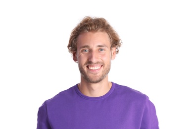 Photo of Handsome young man laughing on white background