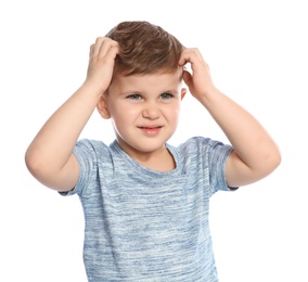 Photo of Little boy scratching head on white background. Annoying itch