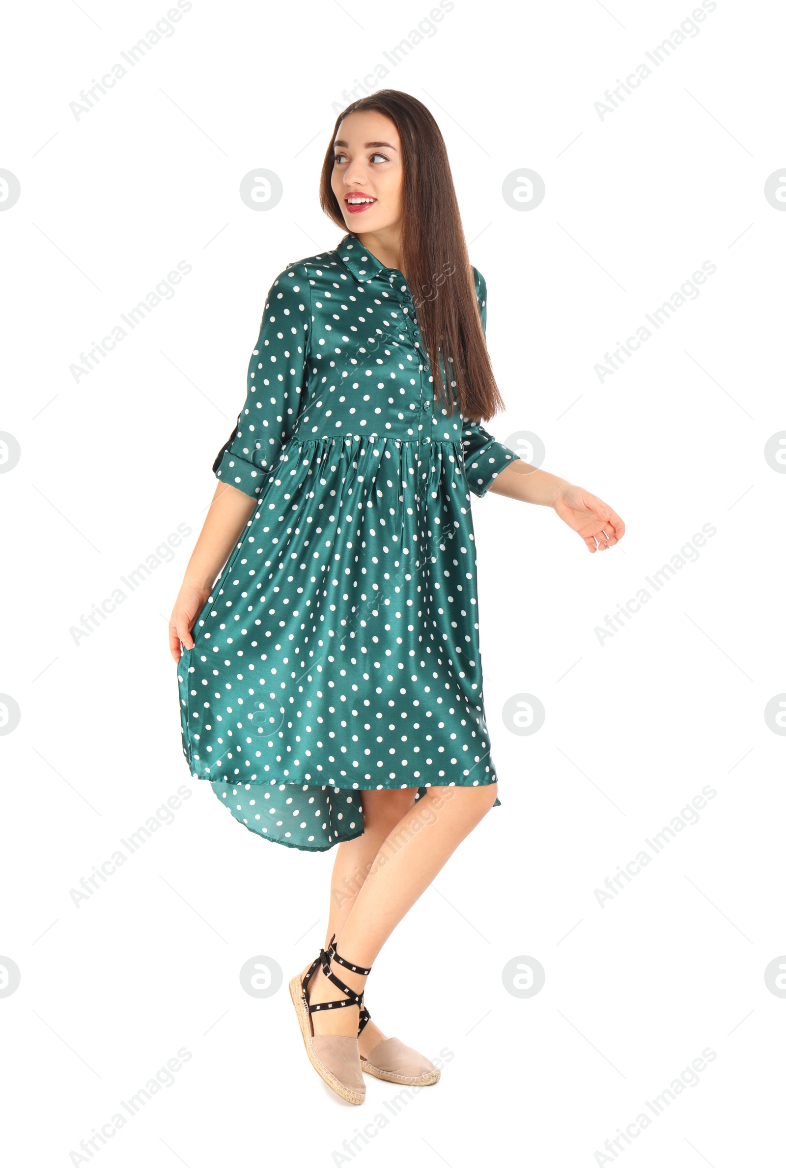 Photo of Portrait of beautiful young woman in stylish dress on white background