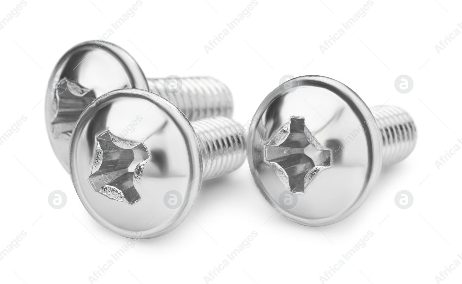 Photo of Three metal truss head screws isolated on white