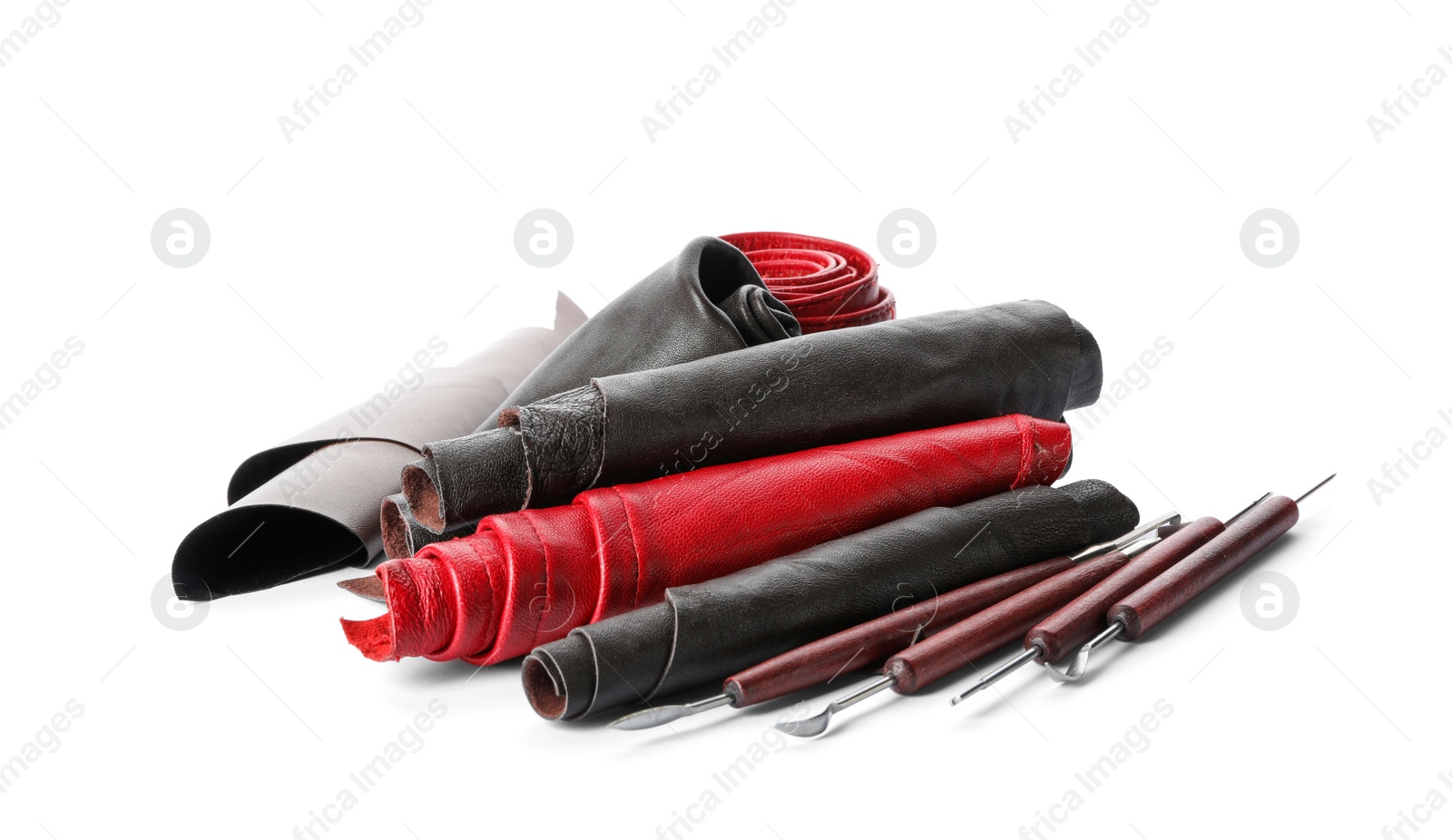 Photo of Leather samples and craftsman tools isolated on white