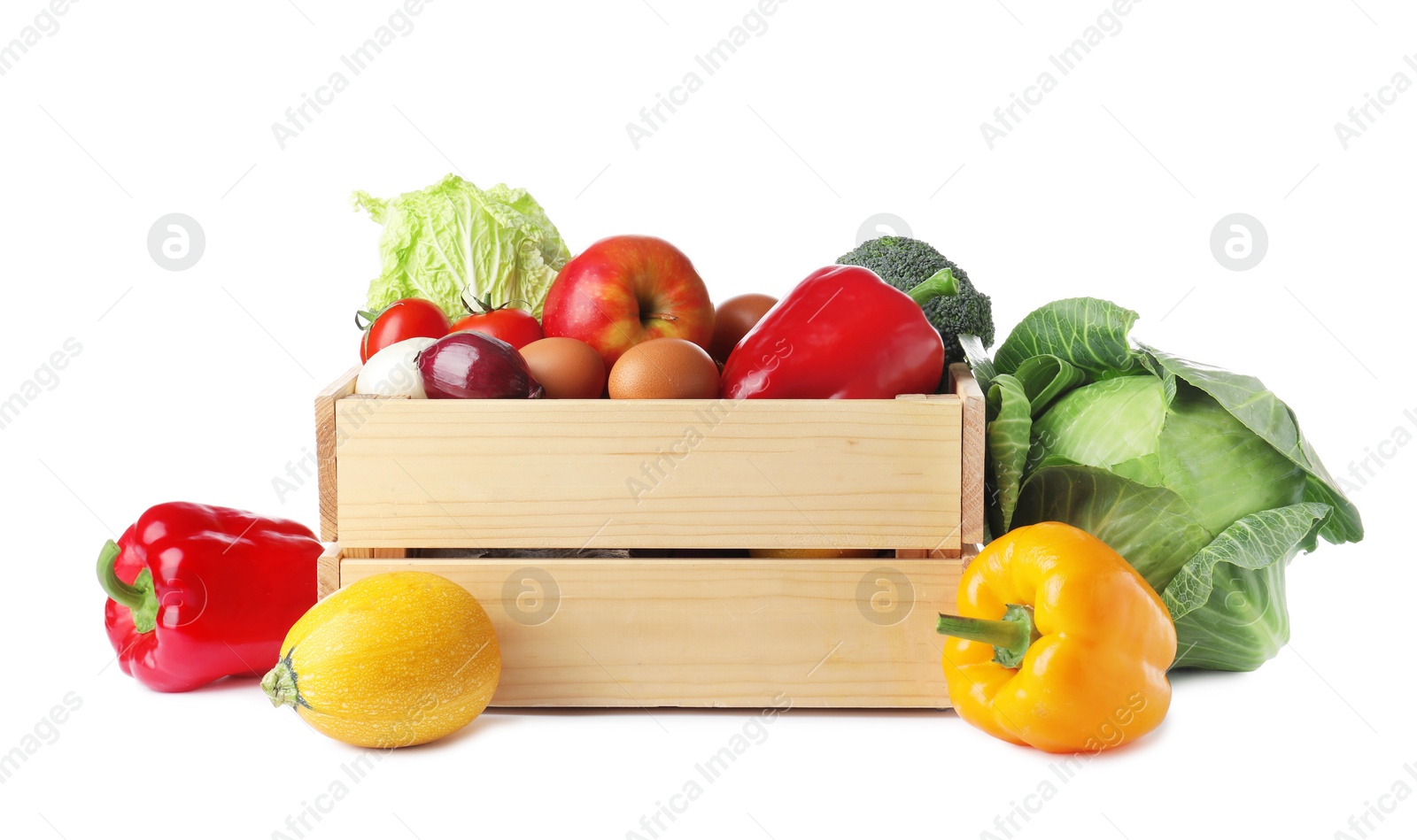 Photo of Wooden crate full of fresh products on white background