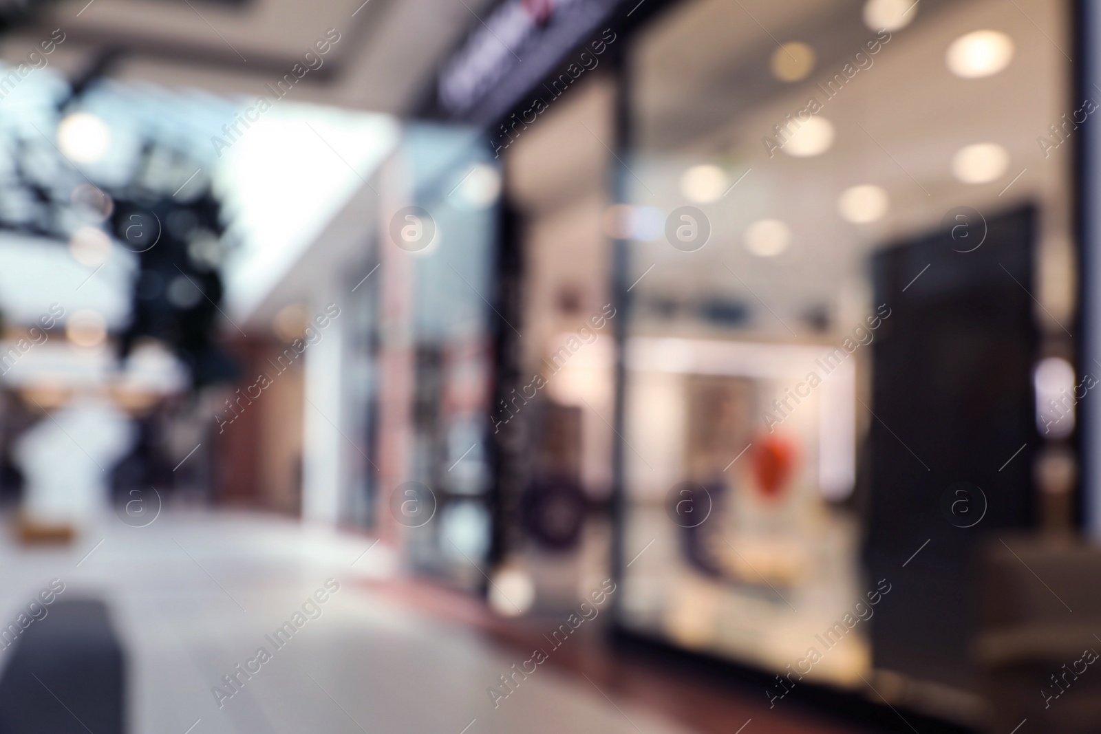 Photo of Blurred view of shopping mall interior. Bokeh effect