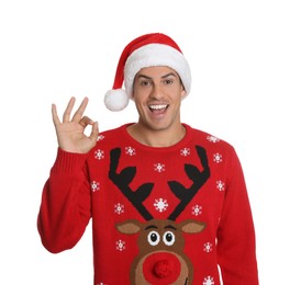Photo of Excited man in Santa hat on white background. Christmas countdown