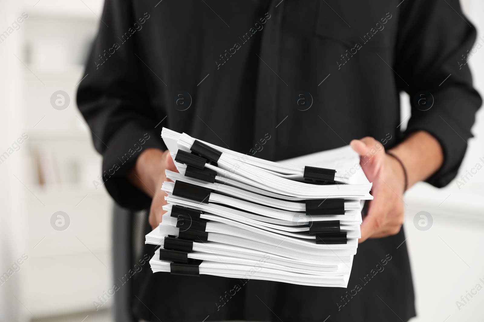 Photo of Businessman with documents in office, closeup view