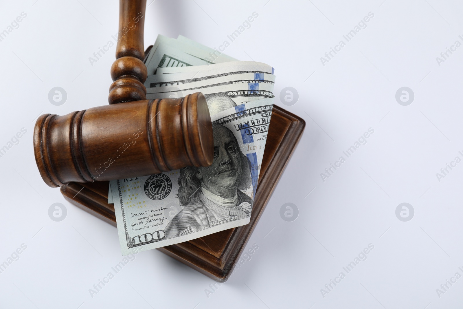 Photo of Judge's gavel and money on white background, top view. Space for text