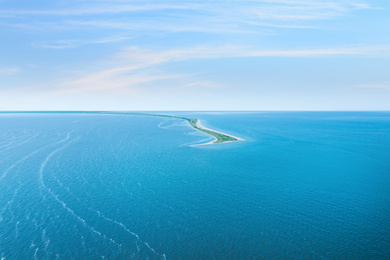 Image of Beautiful seascape with spit under blue sky