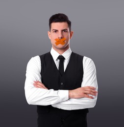 Image of Man with taped mouth on grey background. Speech censorship