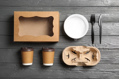 Different containers for mock up design on wooden background, flat lay. Food delivery service