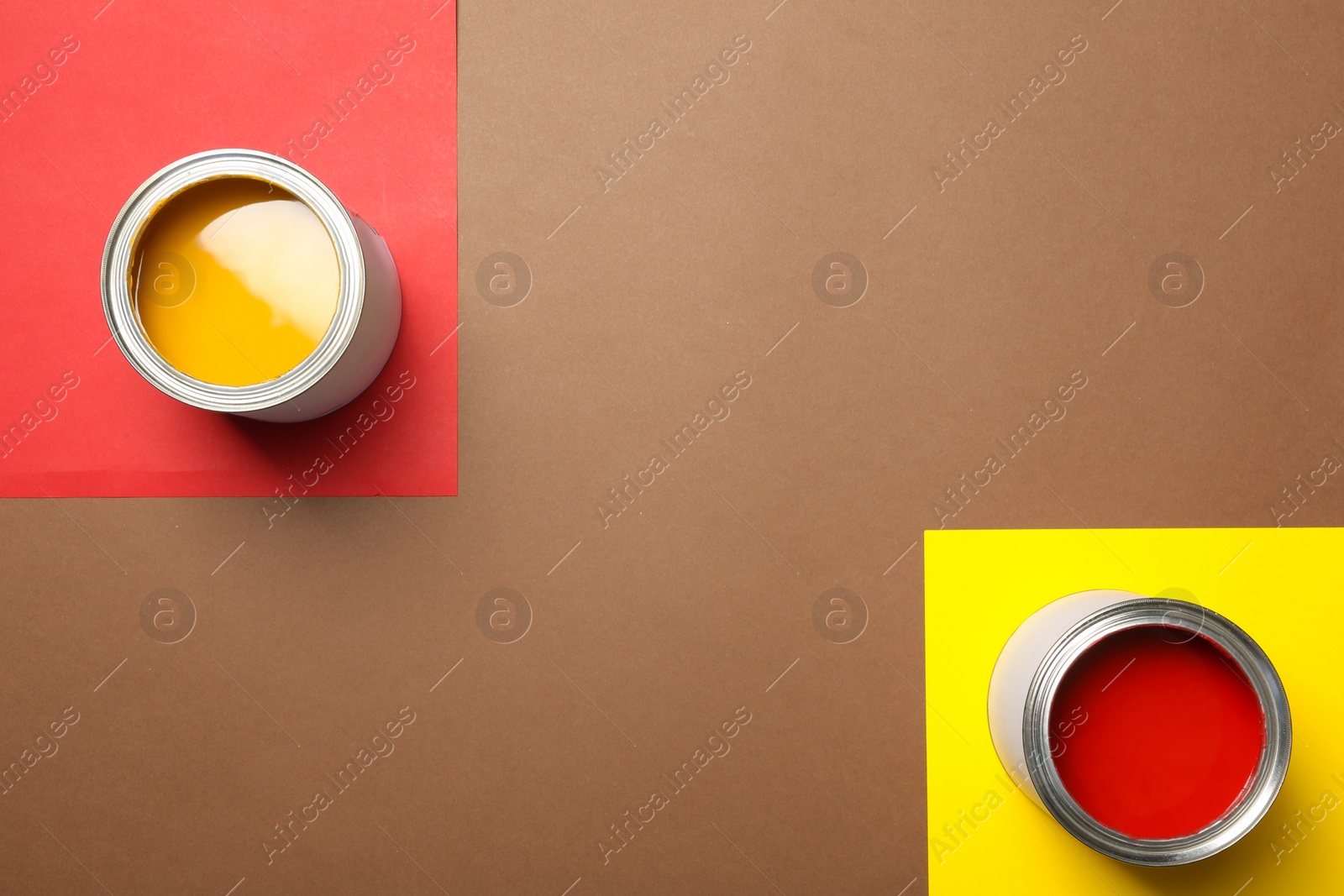 Photo of Flat lay composition with paint cans and space for text on color background