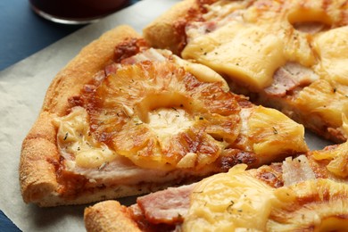 Photo of Delicious cut pineapple pizza on table, closeup