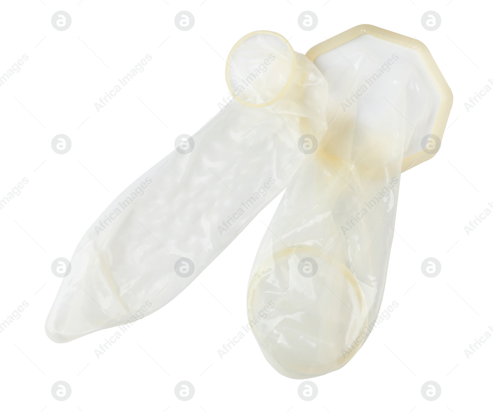 Photo of Unrolled female and male condoms isolated on white, top view. Safe sex