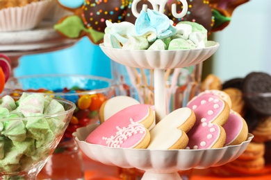 Photo of Candy bar with delicious treats for birthday party, closeup