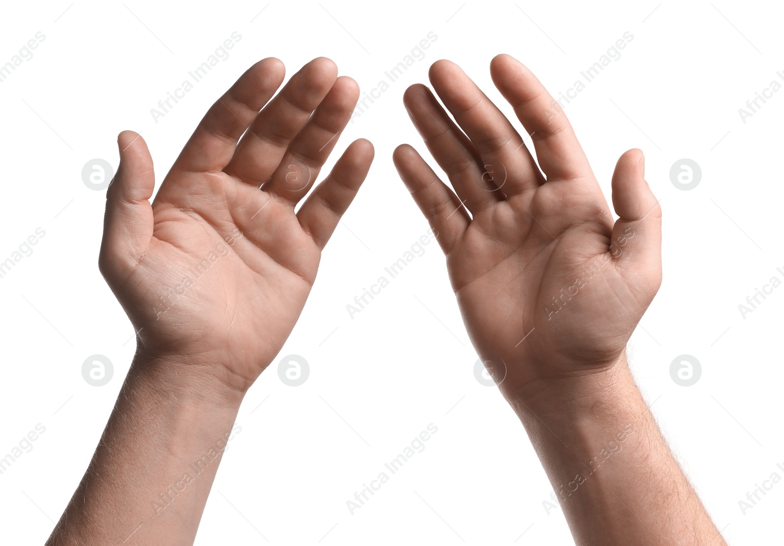 Photo of Religion. Man with open palms praying on white background, closeup