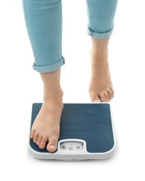 Photo of Woman measuring her weight using scales on white background. Healthy diet