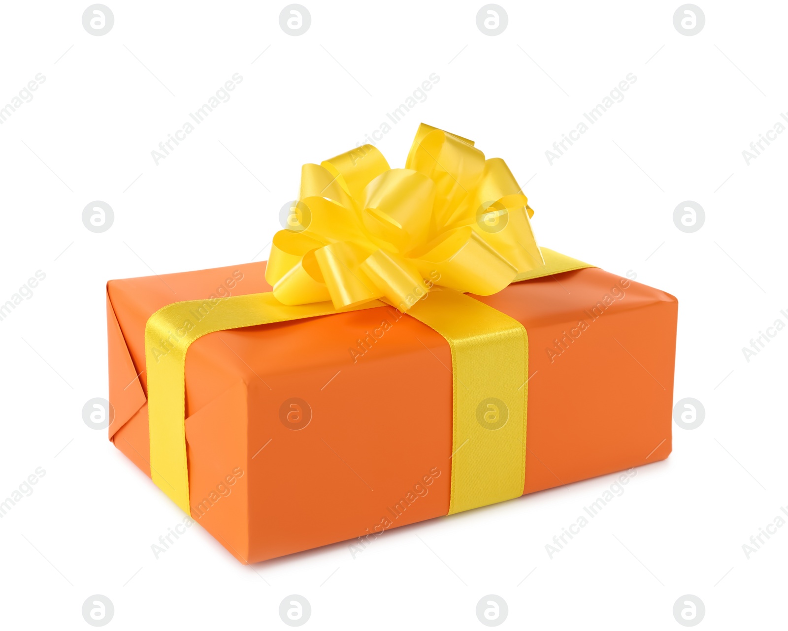 Photo of Orange gift box with yellow bow isolated on white