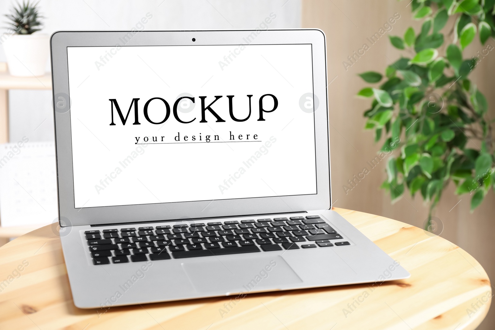 Image of Modern laptop with text Mockup Your Design Here on screen