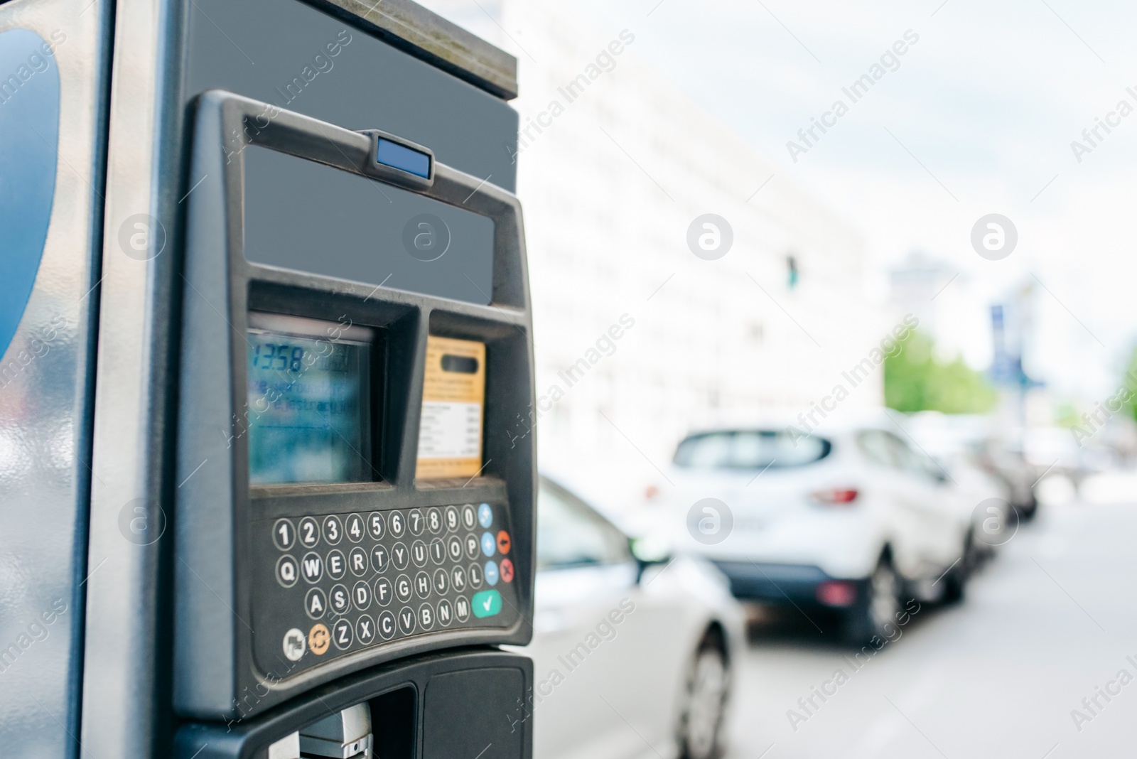 Photo of Parking meter on city street. Space for text